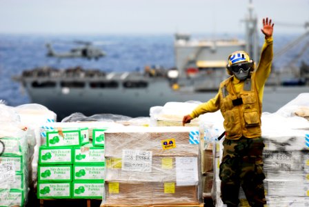 US Navy 090301-N-9950J-336 Aviation Boatswain's Mate (Handling) Airman Bernard Ugalde, from Hawaii, directs a forklift on the flight deck of the forward-deployed amphibious assault ship USS Essex (LHD 2)
