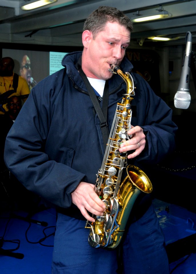 US Navy 090303-N-4014G-188 Air Traffic Controller 1st Class Marcus Wilcox plays the saxophone during the Black History Month Celebration aboard the aircraft carrier USS Dwight D. Eisenhower (CVN 69)