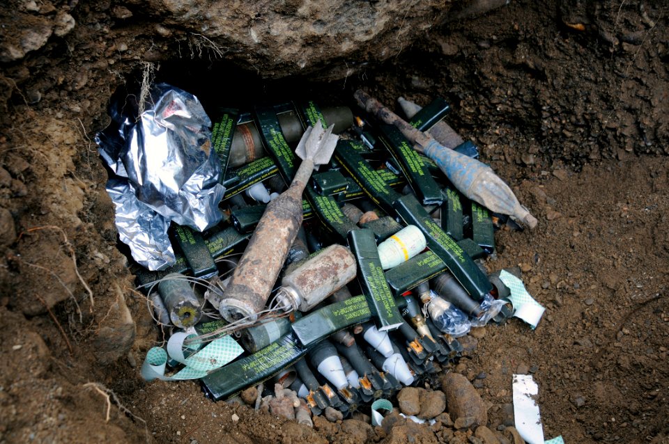 US Navy 090306-N-7130B-267 A cache of live ordnance is wired with C-4 explosive charges before a controlled demolition by members of Philippine Explosive Ordnance Disposal (EOD) agencies in Zamboanga City, Philippines photo