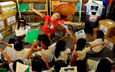 US Navy 090303-N-7130B-018 U.S. Ambassador to the Philippines Kristie A. Kenney reads a children's book to school children at Esperanza Central School photo