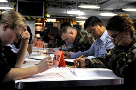 US Navy 090305-N-3589B-039 Sailors take the E-6 advancement exam aboard the nuclear-powered aircraft carrier USS Nimitz (CVN 68)