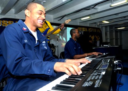 US Navy 090303-N-4014G-162 Hospital Corpsman 1st Class Kenneth Bush plays keyboard with the IKE Band during the Black History Month Celebration aboard the aircraft carrier USS Dwight D. Eisenhower (CVN 69)