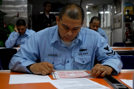 US Navy 090305-N-6936D-001 Boatswains Mate 2nd Class Carllos Gunzales takes the first class petty officer exam