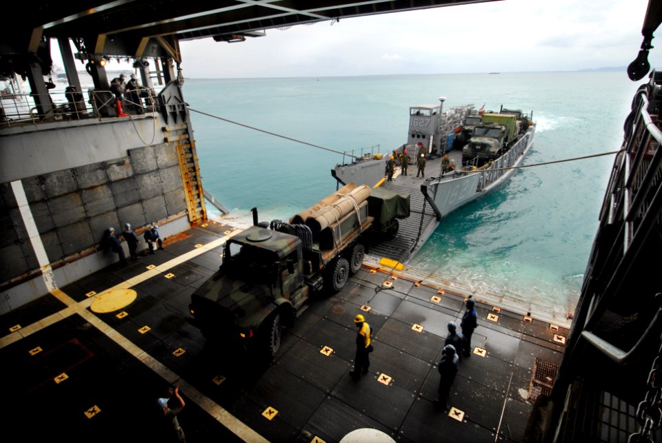 US Navy 090303-N-6936D-012 Sailors and Marines aboard the amphibious dock landing ship USS Tortuga (LSD 46) load vehicles onto Landing Craft Utility (LCU) 1627