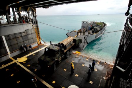 US Navy 090303-N-6936D-012 Sailors and Marines aboard the amphibious dock landing ship USS Tortuga (LSD 46) load vehicles onto Landing Craft Utility (LCU) 1627