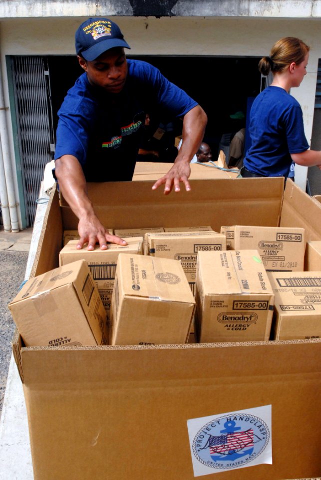 US Navy 090304-N-1688B-157 Seaman Christopher Blandford, assigned to the amphibious transport dock ship USS Nashville (LPD 13), delivers medical supplies donated by Project Handclasp and Project Hope to Effia Nkwanta hospital