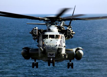 US Navy 090309-N-4236E-028 A CH-53E Super Stallion assigned to Marine Medium Helicopter Squadron (HMM) 264 prepares to land on the flight deck of the multi-purpose amphibious assault ship USS Iwo Jima (LHD 7) photo
