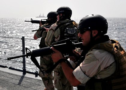 US Navy 090304-N-4774B-017 Members of a visit, board, search, and seizure team from the U.S. Coast Guard high endurance cutter Boutwell (WHEC 719) conduct drills aboard the guided-missile cruiser USS Lake Champlain (CG 57) photo