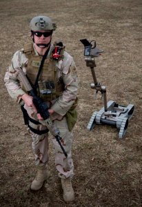 US Navy 090310-N-7090S-001 Explosive ordnance disposal technicians are using remote-controlled machines to help detect and defuse improvised explosive devices photo
