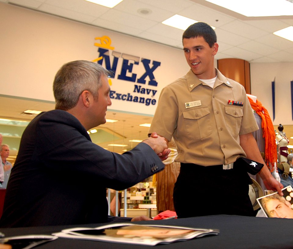 US Navy 090305-N-9689V-002 Taylor Hicks visits with Sailors and other visitors during an album signing at the Navy Exchange onboard Naval Air Station, North Island