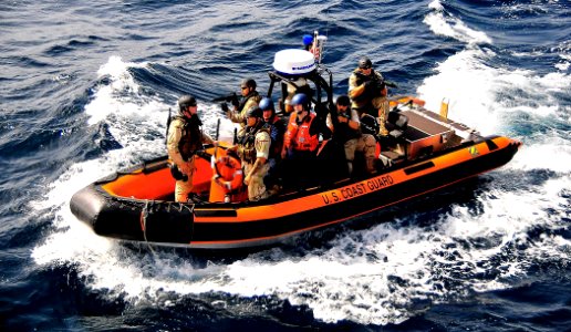 US Navy 090304-N-4774B-008 Members of a visit, board, search, and seizure team from the U.S. Coast Guard high endurance cutter Boutwell (WHEC 719) prepare to board the guided-missile cruiser USS Lake Champlain (CG 57) photo