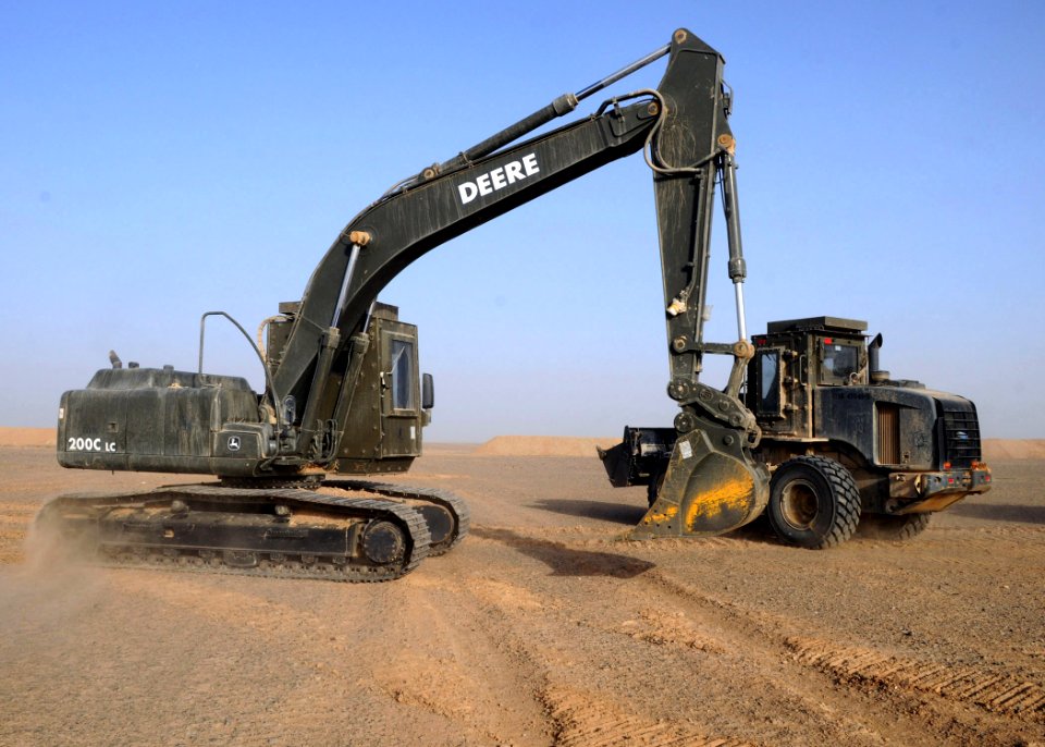 US Navy 090305-N-1120L-026 Seabees assigned to Naval Mobile Construction Battalion (NMCB) 7 conduct pre-start checks on battalion civil engineer support equipment before working on a project site