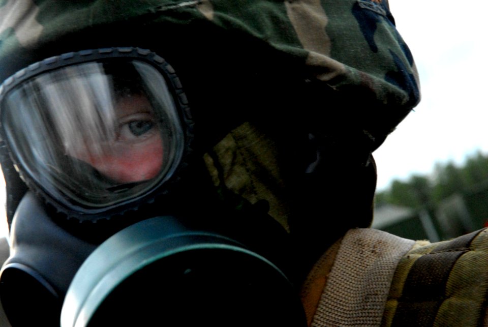 US Navy 090316-N-3674H-194 A Seabee assigned to Naval Mobile Construction Battalion (NMCB) 74 waits out a chemical attack during a field training exercise at Camp Shelby, Miss