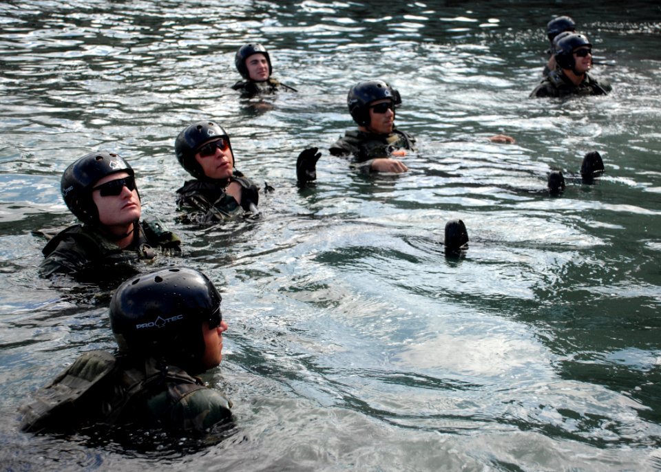US Navy 090305-N-5366K-015 Special Warfare Combatant-craft Crewmen candidates check the integrity of their floatation devices