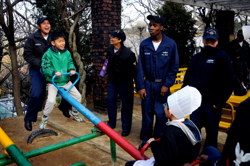 US Navy 090306-N-7280V-163 Sailors assigned to the amphibious command ship USS Blue Ridge (LCC 19) play with children at the Hee-Rak-Won Orphanage during a community service project