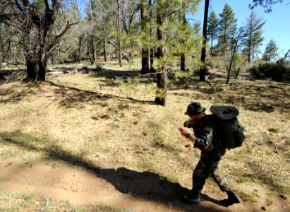 US Navy 090317-N-2959L-895 Basic Underwater Demolition-SEAL (BUDs) candidate Seaman Jared Hougtalen checks his map as he walks to find his next checkpoint during an individual basic land navigation exercise