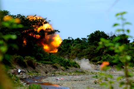 US Navy 090306-N-7130B-321 A fireball erupts from a blast site as a cache of live ordnance is detonated by Philippine Explosive Ordnance Disposal (EOD) personnel near Zamboanga City, Philippines photo
