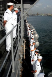US Navy 090317-N-1688B-015 Sailors aboard the amphibious transport dock ship USS Nashville (LPD 13) salute the Nigerian Navy frigate NNS Aradu (F 89) while pulling into Lagos Nigeria