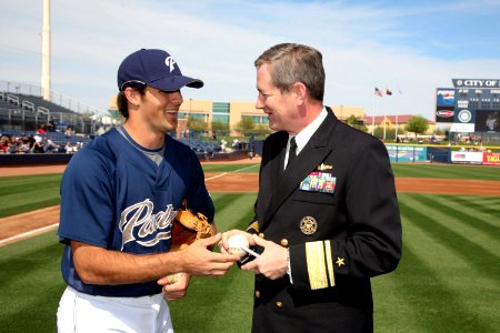 US Navy 090306-N-3271W-040 San Diego Padres pitcher Mitch Canham signs a baseball for Rear Adm. Leendert R. Hering Sr., commander of Navy Region Southwest after Hering threw the first pitch at a pre-season game