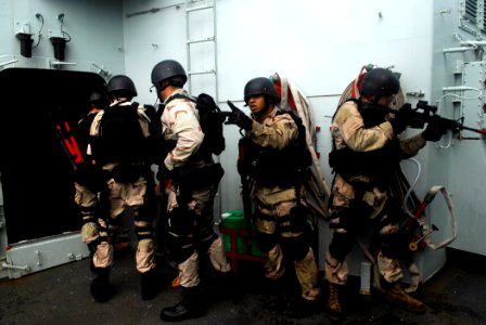 US Navy 090307-N-9610C-045 A visit, board, search, and seizure team from USS Kidd (DDG 100) participates in close quarters battle tactics photo