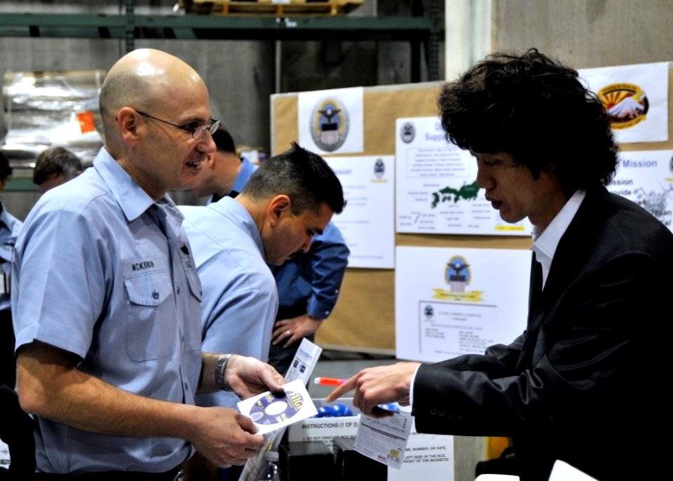 US Navy 090319-N-2013O-006 Storekeeper 1st Class Mark McKibbin speaks to a representative of the Defense Logistics Agency