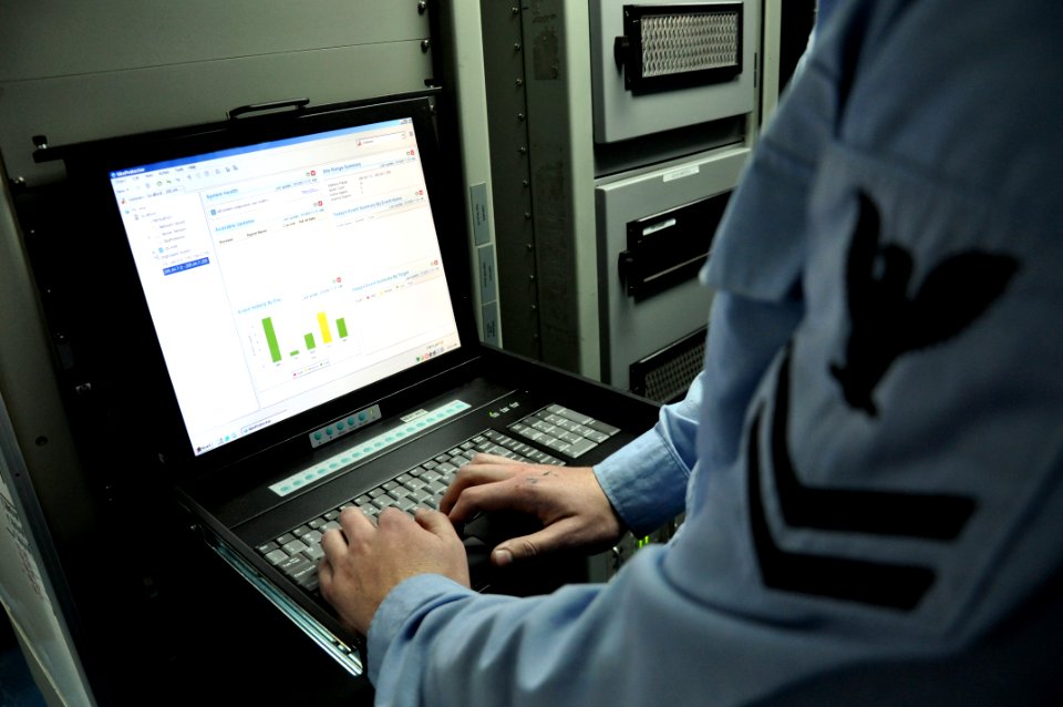 US Navy 090310-D-5972N-009 Information Systems Technician 2nd Class Ryan Allshouse uses the intrusion detection system to monitor unclassified network activity from the automated data processing workspace