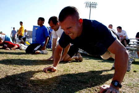 US Navy 090314-N-5366K-056 Athletes battle through two minutes of push ups during the Navy SEAL Fitness Challenge at Arizona State University in Phoenix photo