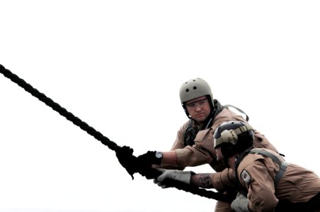 US Navy 090319-N-7730P-161 Hospital Corpsman 2nd Class John Dawson and Chief Explosive Ordnance Disposal Brian Lehtinen, assigned to Explosive Ordnance Disposal Mobile Unit (EODMU) 11 Platoon 0-2, man a fast-rope