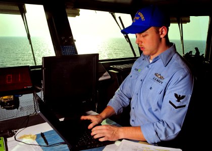 US Navy 090317-N-7571S-003 Quartermaster 3rd Class Christopher McGrew, quartermaster of the watch, records an entry into the ship's deck log aboard the Nimitz-class aircraft carrier USS Theodore Roosevelt (CVN 71)