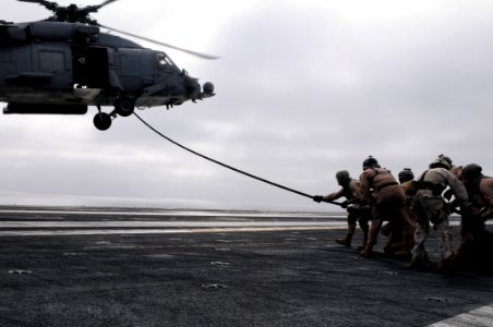 US Navy 090319-N-7730P-154 Members of Explosive Ordnanace Disposal Mobile Unit 11, Platoon 0-2 extend a fast-rope