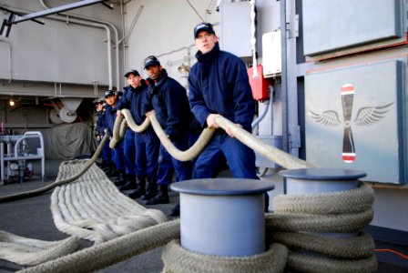 US Navy 090315-N-0096C-030 Sailors handle a mooring line aboard USS John C. Stennis (CVN 74)