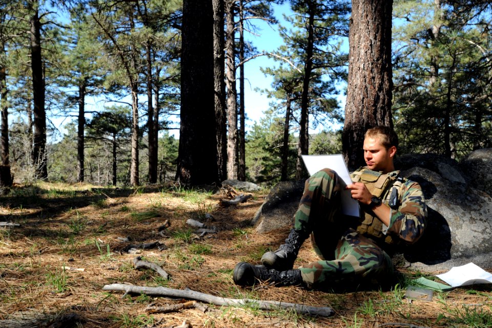 US Navy 090317-N-2959L-923 Basic Underwater Demolition-SEAL (BUD-s) candidate Seaman Jared Hougtalen plots coordinates to his next checkpoint during an individual basic land navigation exercise