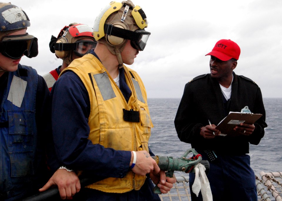 US Navy 090317-N-9134V-020 Senior Chief Storekeeper Sharmon Hardaway instructs Sailors during a crash and smash drill aboard the amphibious dock landing ship USS Carter Hall (LSD 50)