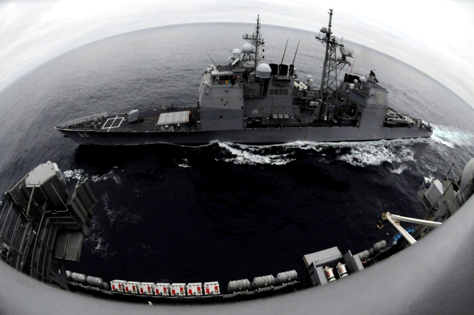 US Navy 090321-N-7730P-005 The guided-missile cruiser USS Chancellorsville (CG 62) is underway beside the aircraft carrier USS Ronald Reagan (CVN 76) before a fueling at sea