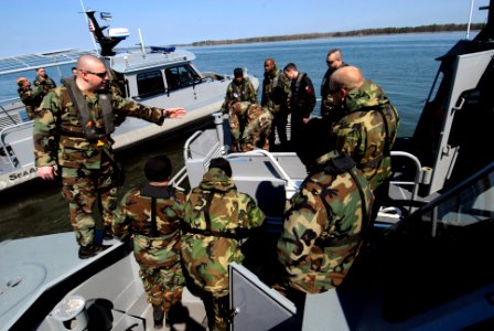 US Navy 090318-N-7544A-287 Sailors from Navy Reserve Marine Expeditionary Boat Detachment 421 conduct training aboard a 34-foot Sea Ark Navy security boat on the York River photo