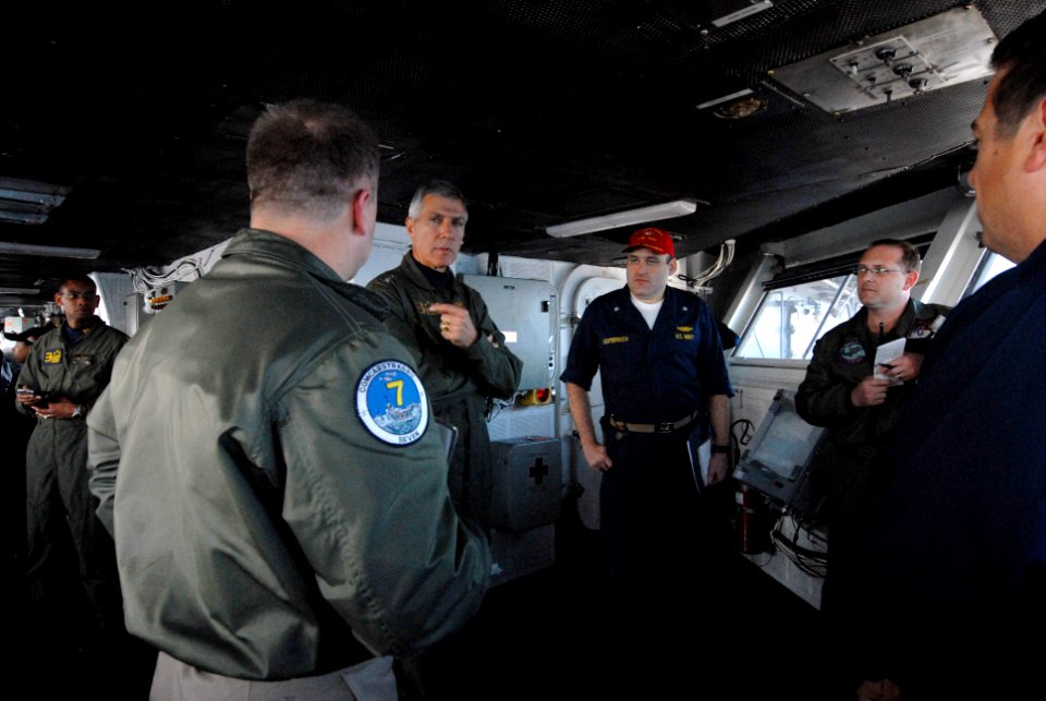 US Navy 090317-N-4995K-032 Vice Adm. Sam Locklear, commander, U.S. 3rd. Fleet, speaks with Capt. Kenneth Norton, commanding officer of the aircraft carrier USS Ronald Reagan (CVN 76), on the bridge of the ship before adressing