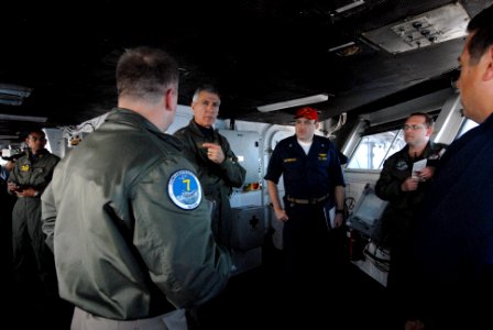 US Navy 090317-N-4995K-032 Vice Adm. Sam Locklear, commander, U.S. 3rd. Fleet, speaks with Capt. Kenneth Norton, commanding officer of the aircraft carrier USS Ronald Reagan (CVN 76), on the bridge of the ship before adressing photo