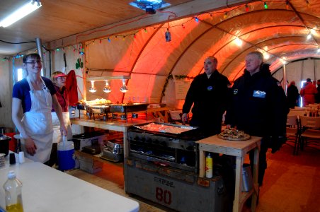 US Navy 090321-N-8273J-668 Chief of Naval Operations (CNO) Adm. Gary Roughead speaks with personnel at the Applied Physics Lab Ice Station while touring the camp in the Arctic Ocean during Ice Exercise 2009 photo