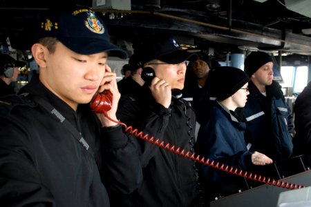 US Navy 090318-N-9123L-003 Ensign Allan Aw and Republic of Korea Navy Ensign Do-Hee Jung conduct communications between the guided-missile destroyer USS John S. McCain (DDG 56) and the Republic of Korea Navy oiler Hwachon (AOE