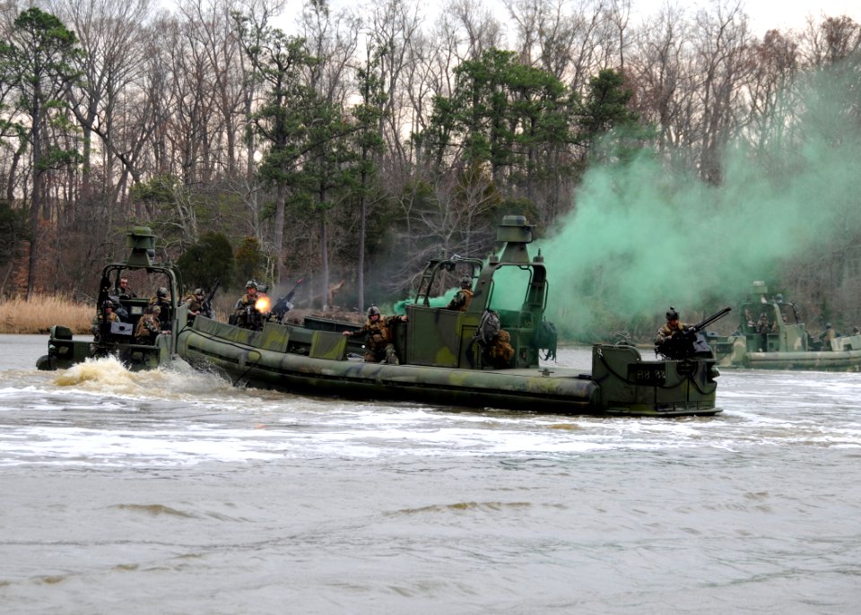 US Navy 090319-N-4267W-272 Sailors assigned to Riverine Squadron (RIVRON) 3 simulate towing a damaged riverine patrol boat while under attack during a patrol exercise