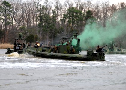 US Navy 090319-N-4267W-272 Sailors assigned to Riverine Squadron (RIVRON) 3 simulate towing a damaged riverine patrol boat while under attack during a patrol exercise