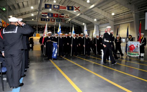 US Navy 090320-N-8848T-207 Recruit Division 124 enters USS Midway Drill Hall at Recruit Training Command during for their graduation ceremony