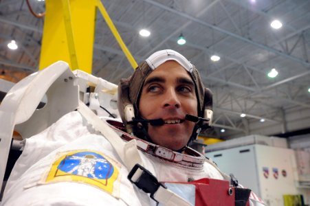 US Navy 090324-N-2959L-189 Lt. Cmdr. Chris Cassidy smiles after donning his space suit during zero gravity training at the Neutral Buoyancy Lab (NLB)