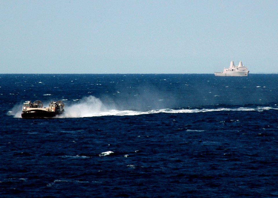 US Navy 090324-N-4236E-068 A landing craft air cushion from Assault Craft Unit (ACU) 4 passes near the amphibious transport dock ship USS San Antonio (LPD 17)
