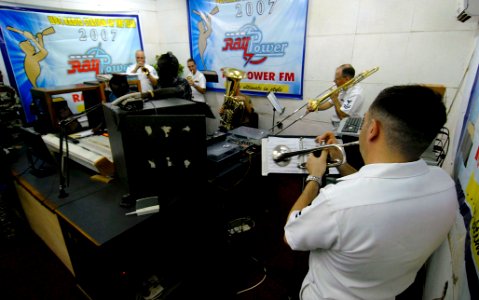 US Navy 090321-N-7948C-117 Members of a Commander, Naval Forces Europe and Africa brass quintet play a live radio performance at a radio station in Lagos, Nigeria