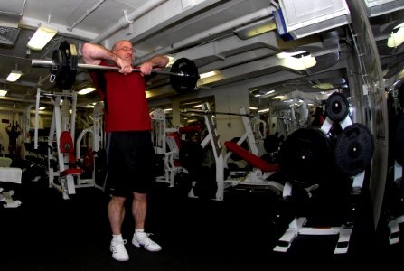 US Navy 090321-N-0096C-101 Chief Interior Communications Electrician Patrick Harding, from Corvallis, Ore., lifts weights in the forward gym aboard the aircraft carrier USS John C. Stennis (CVN 74)