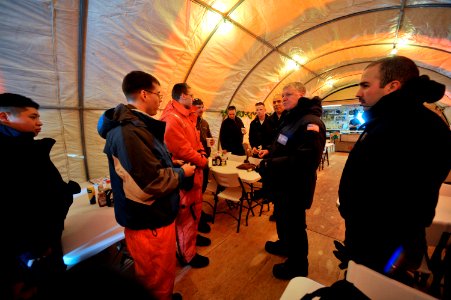 US Navy 090321-N-8273J-465 Chief of Naval Operations (CNO) Adm. Gary Roughead speaks with Sailors from the Los Angeles-class submarine USS Annapolis (SSN 760) while visiting the Applied Physics Lab Ice Station camp in the Arcti photo