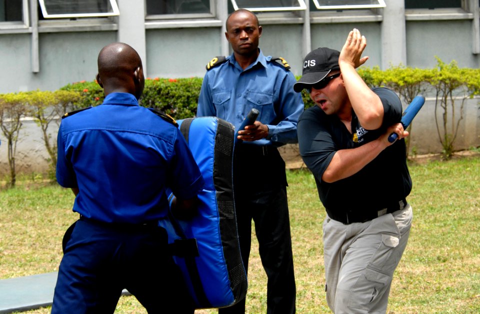 US Navy 090323-N-1688B-302 Chief Master at Arms Felix Rivera demonstrates proper non-lethal self-defense methods during a port security seminar for members of the Nigerian Navy while during an Africa Partnership Station port vi