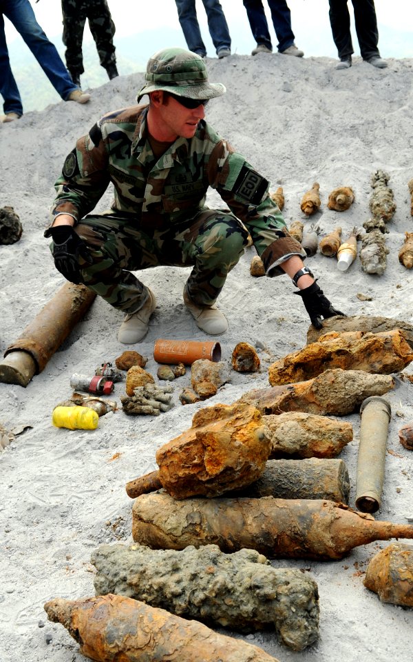 US Navy 090325-N-7130B-070 Chief Explosive Ordnance Disposal Technician Kenneth Simpson, assigned to Joint Special Operations Task Force-Philippines Explosive Ordnance Disposal Task Unit, inspects ordnance before a scheduled or
