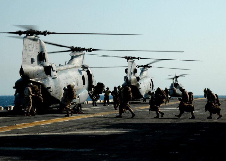 US Navy 090324-N-4236E-301 Marines from the 26th Marine Expeditionary Unit (MEU) prepare to disembark the multi-purpose amphibious assault ship USS Iwo Jima (LHD 7)